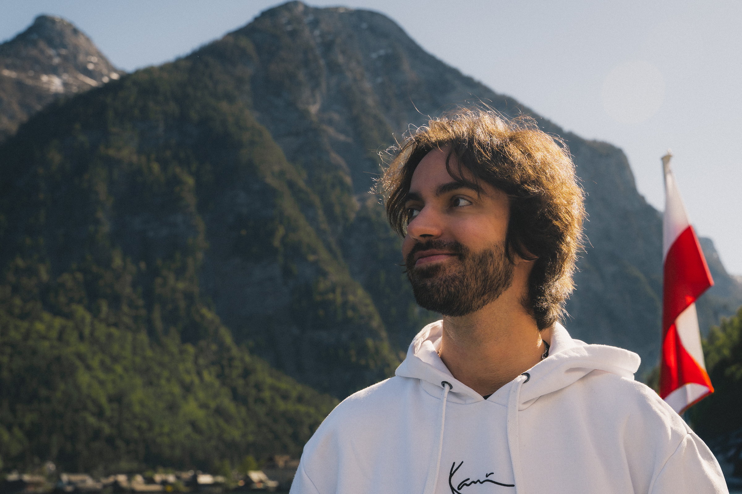 Julian in front of the mountains at Hallstatt